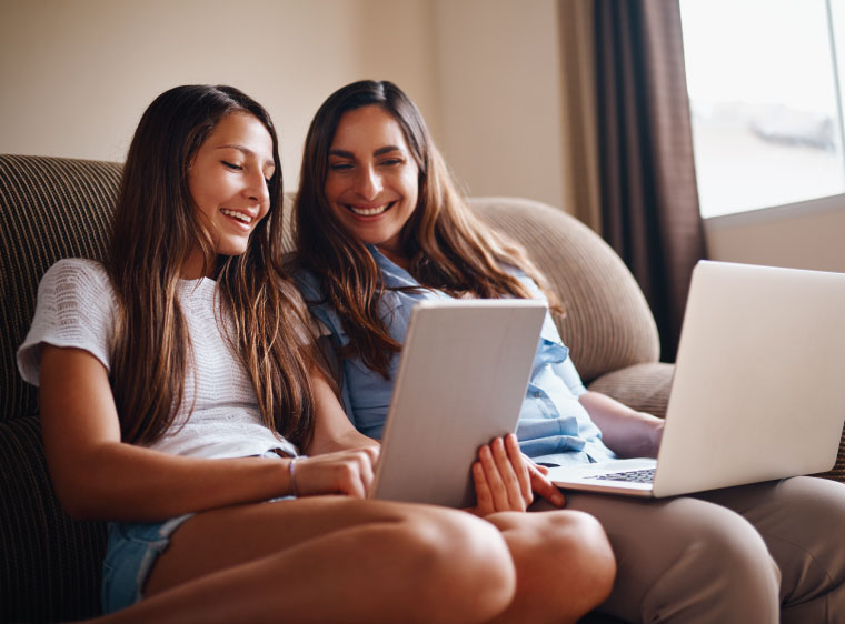 parent and child researching on laptop