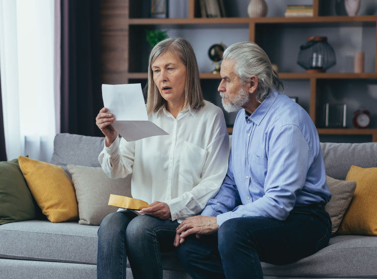 Older couple looking at document