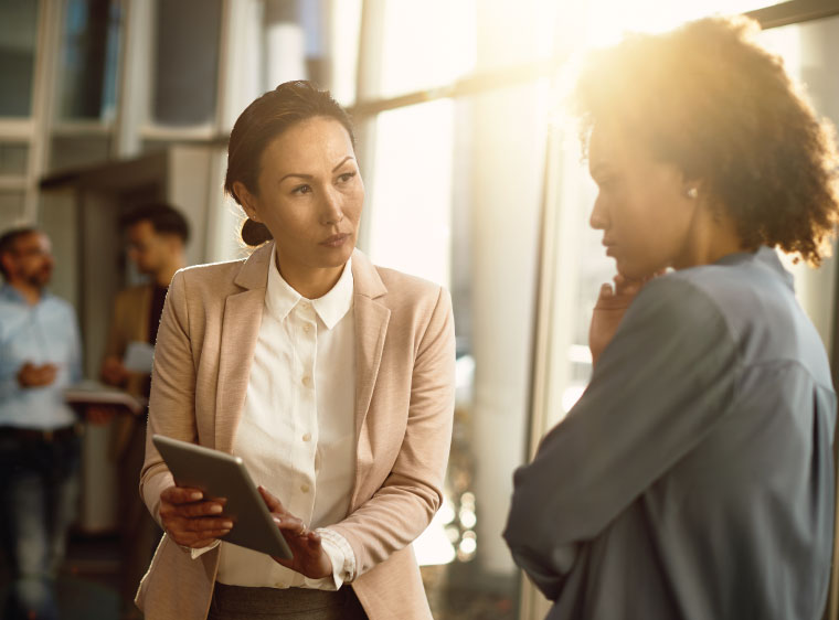 Two women reviewing data